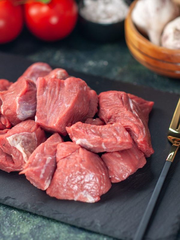 front-close-view-fresh-raw-chopped-meats-cutlery-set-wooden-board